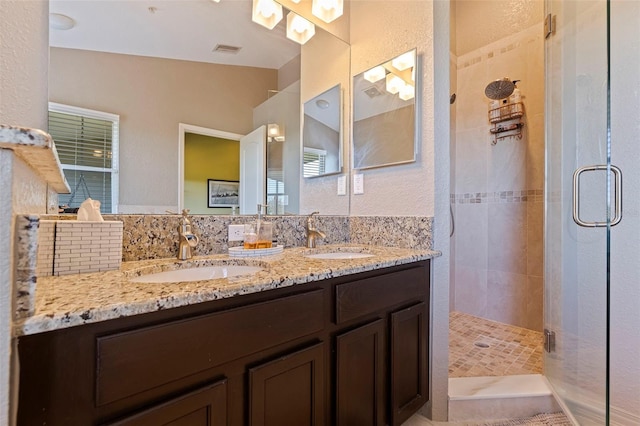 bathroom with vanity, an enclosed shower, and lofted ceiling