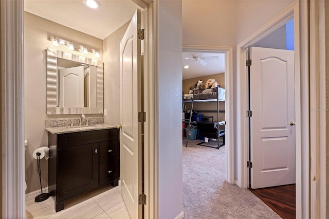 bathroom with vanity and ceiling fan