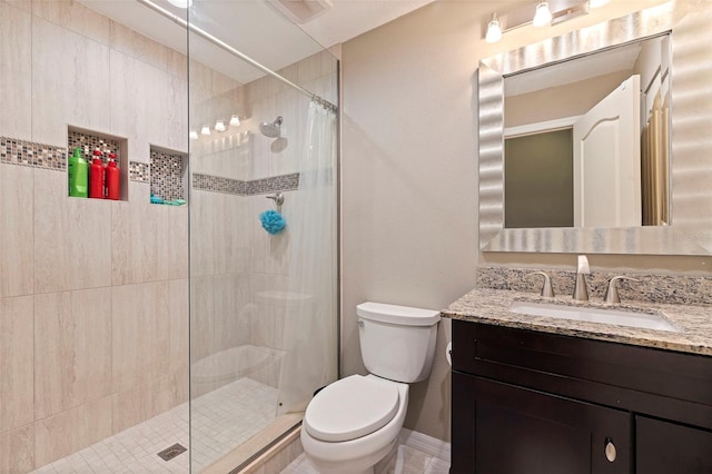 bathroom with toilet, vanity, and a shower with shower curtain