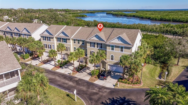 drone / aerial view featuring a water view