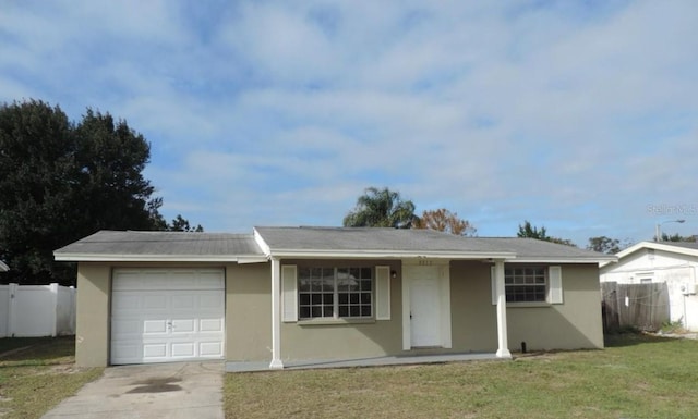 single story home with a front lawn and a garage