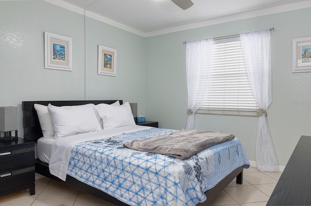 bedroom featuring ceiling fan, light tile patterned floors, and crown molding