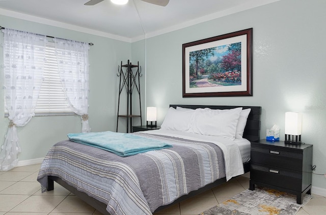 tiled bedroom featuring ceiling fan and crown molding