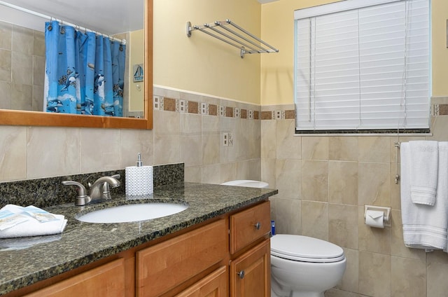 bathroom featuring vanity, a shower with shower curtain, tile walls, and toilet