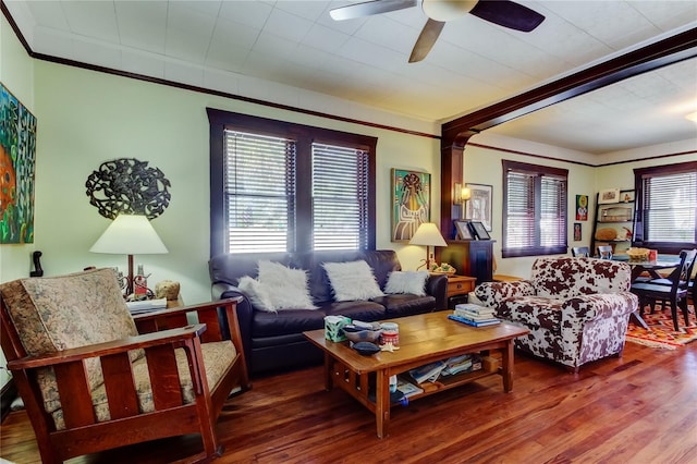 living room featuring ceiling fan, crown molding, and hardwood / wood-style flooring