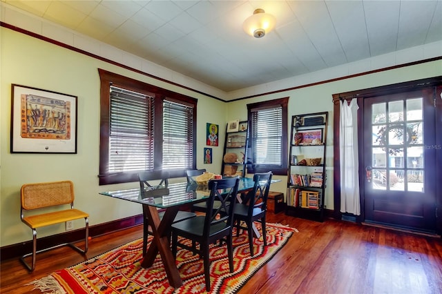 dining space featuring dark hardwood / wood-style flooring and a wealth of natural light