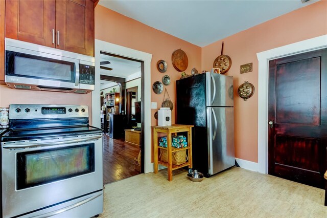 kitchen featuring appliances with stainless steel finishes and light wood-type flooring