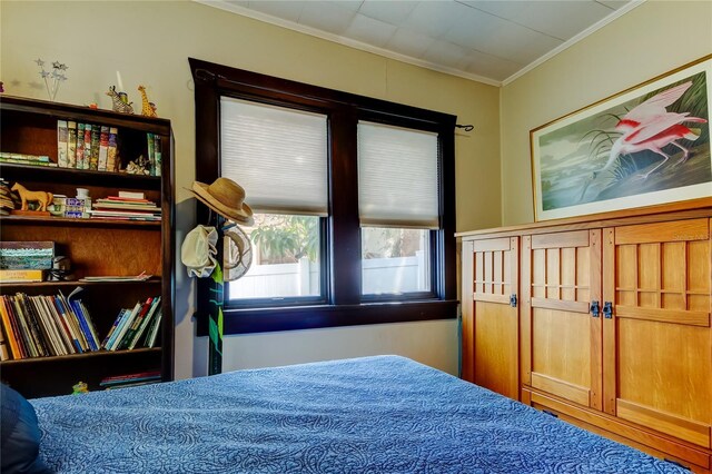 bedroom with crown molding