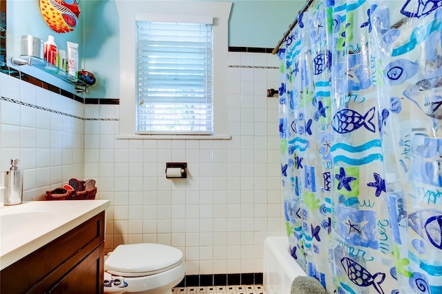 full bathroom with vanity, shower / bathtub combination with curtain, tile walls, tile patterned flooring, and toilet