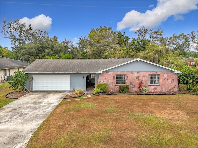 ranch-style home with a front yard and a garage