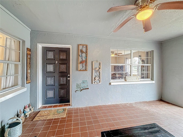 entrance to property featuring ceiling fan