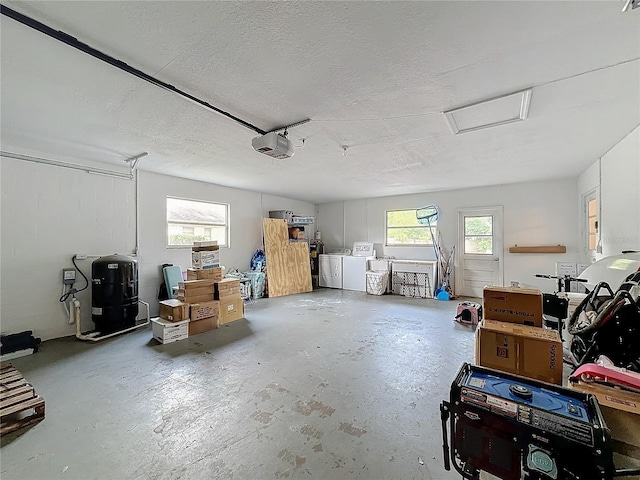 garage featuring washer and clothes dryer and a garage door opener