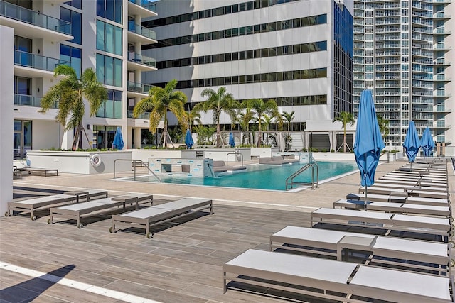 view of swimming pool with a patio