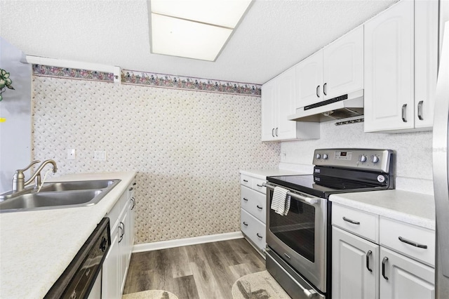 kitchen featuring white cabinetry, sink, dishwasher, wood-type flooring, and stainless steel electric range