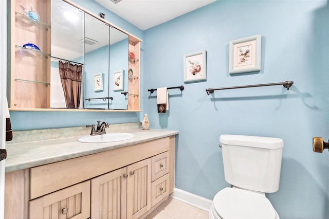 bathroom with tile patterned floors, vanity, a shower with shower curtain, and toilet