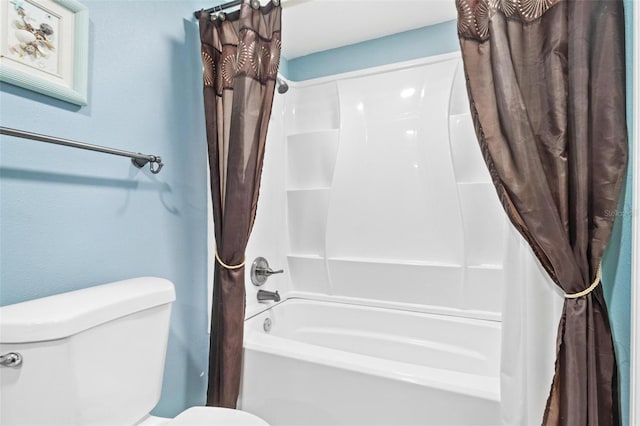 bathroom with toilet and shower / bathtub combination with curtain