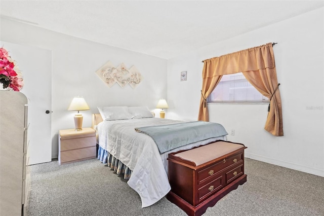 bedroom featuring light colored carpet and fridge