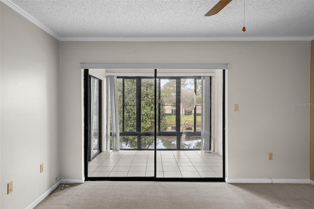 unfurnished room featuring crown molding, light carpet, a textured ceiling, and ceiling fan