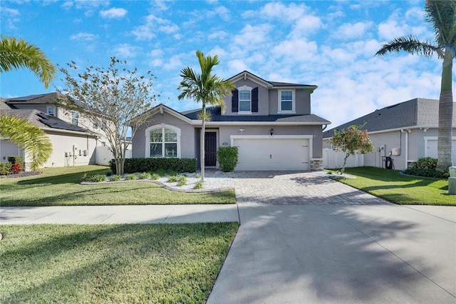 front of property featuring a front yard and a garage