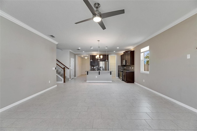 unfurnished living room with ceiling fan with notable chandelier, light tile patterned floors, and crown molding