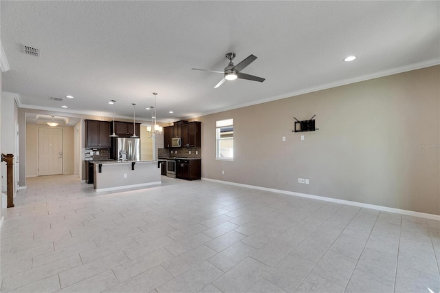 unfurnished living room with ornamental molding, ceiling fan, and light tile patterned floors