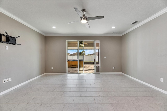 unfurnished room with a textured ceiling, light tile patterned floors, and crown molding