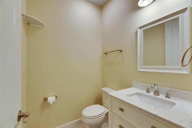 bathroom with toilet and vanity