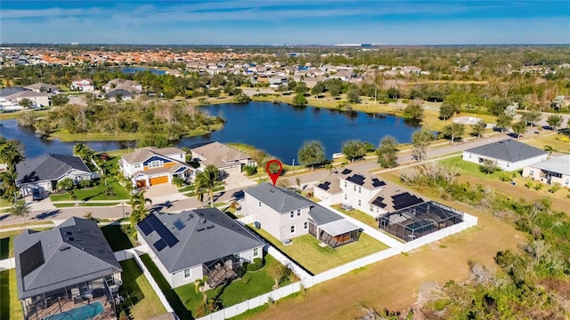 birds eye view of property featuring a water view