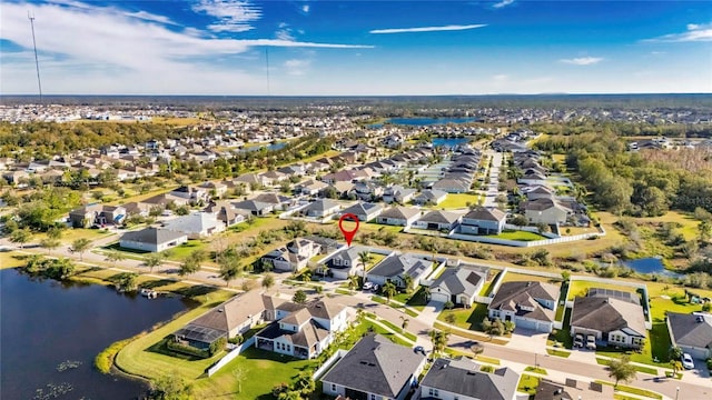 drone / aerial view with a water view