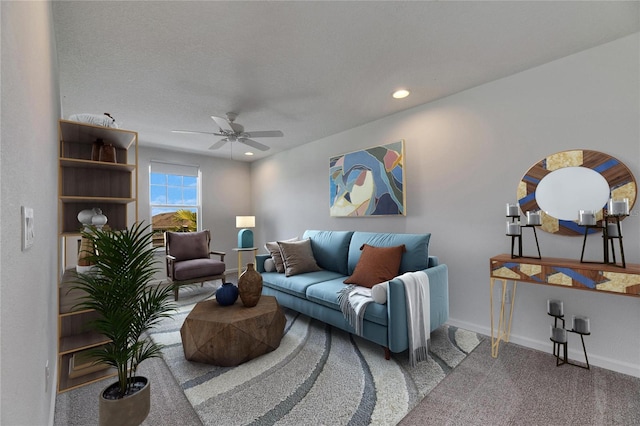 carpeted living room featuring ceiling fan