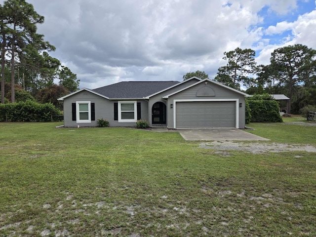 ranch-style home featuring a garage and a front yard