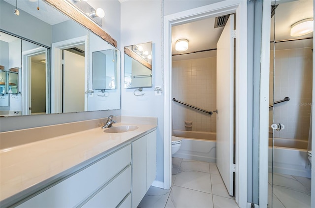 full bathroom with vanity, toilet, and tiled shower / bath