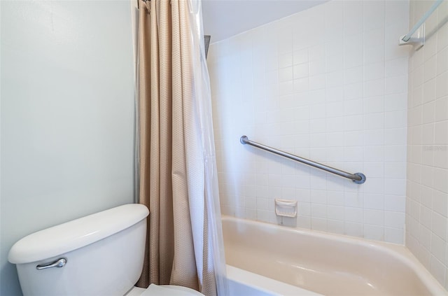 bathroom with shower / bath combo and toilet