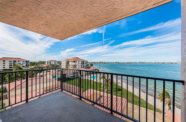 balcony featuring a water view