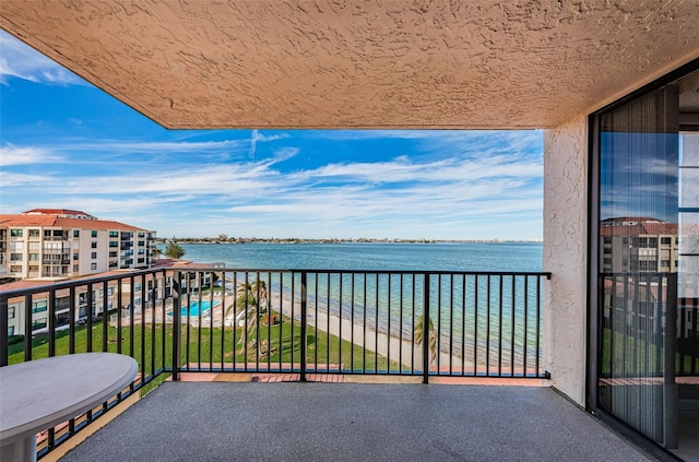 balcony featuring a water view