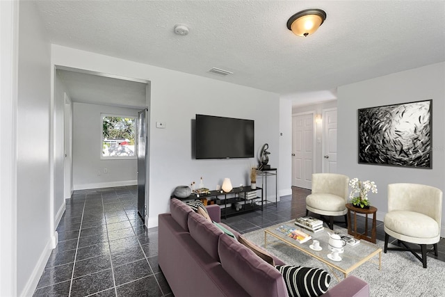 living room with a textured ceiling