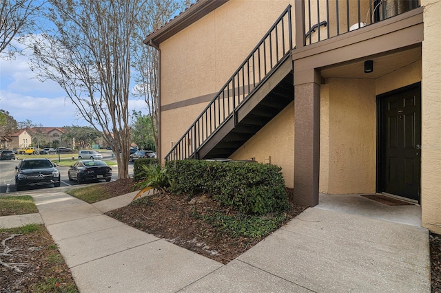 view of side of property with a balcony