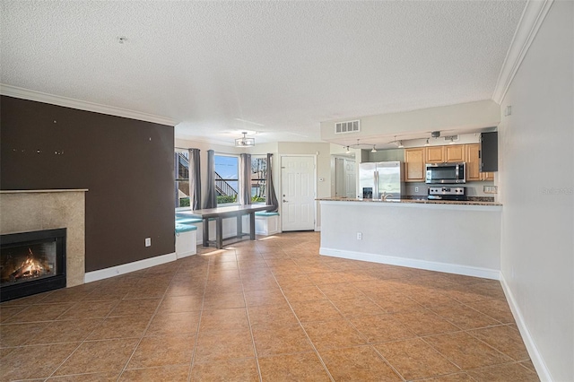 unfurnished living room with a high end fireplace, light tile patterned flooring, a textured ceiling, and ornamental molding