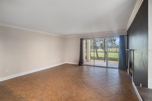 tiled empty room featuring a textured ceiling and crown molding