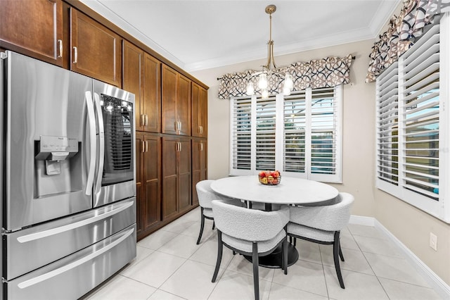 kitchen with pendant lighting, stainless steel fridge with ice dispenser, a chandelier, light tile patterned flooring, and crown molding