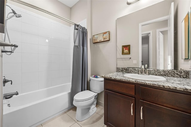 full bathroom featuring toilet, vanity, tile patterned floors, and shower / bath combination with curtain