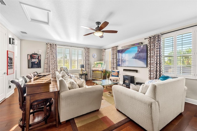 living room featuring crown molding, a healthy amount of sunlight, hardwood / wood-style flooring, and ceiling fan