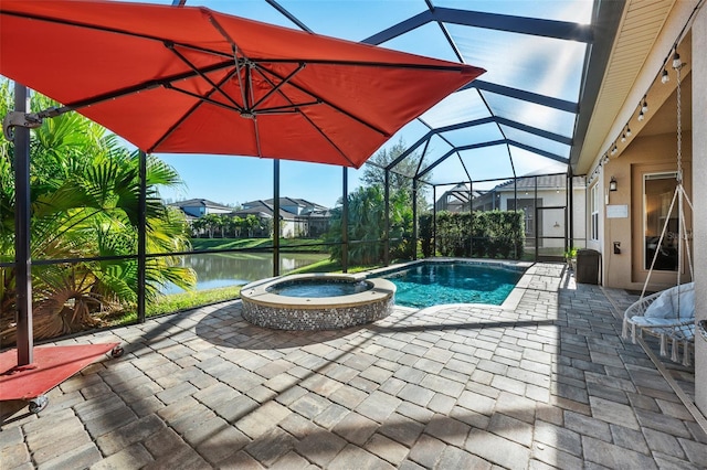 view of swimming pool featuring a water view, a patio area, a lanai, and an in ground hot tub