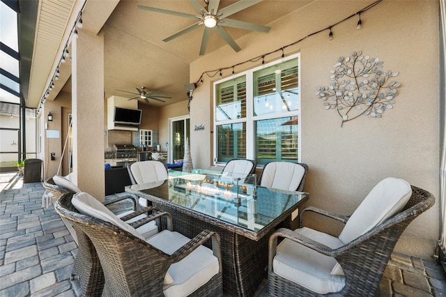 view of patio with ceiling fan and a grill