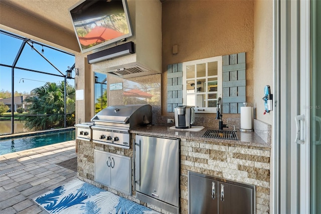 view of patio / terrace featuring a lanai, an outdoor wet bar, a grill, and area for grilling