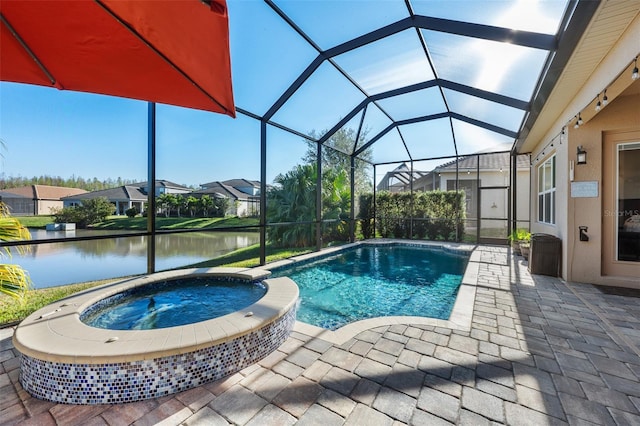 view of swimming pool with a water view, a patio area, glass enclosure, and an in ground hot tub