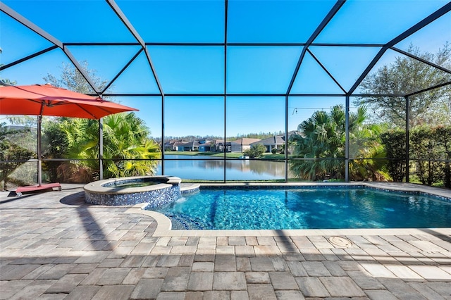 view of pool with an in ground hot tub, a lanai, and a water view