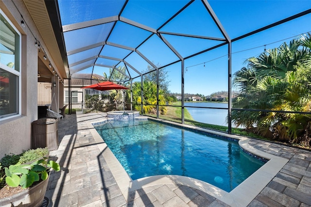 view of swimming pool featuring a lanai, a patio area, a water view, and an in ground hot tub