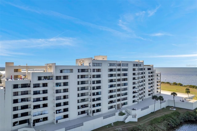 view of building exterior featuring a water view