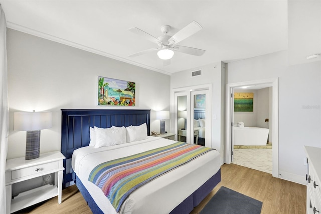 bedroom with ceiling fan and light hardwood / wood-style floors